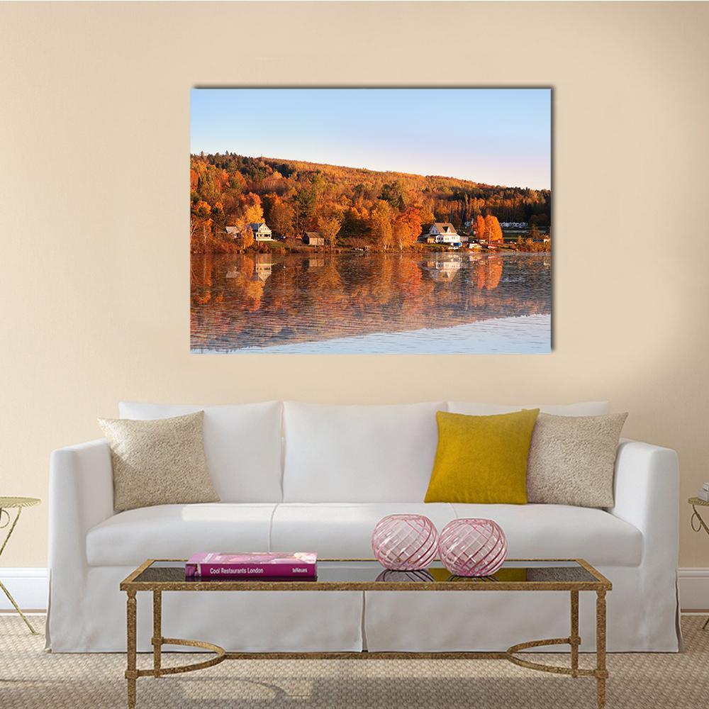 Autumn Hillside Lake Reflection Canvas Wall Art in brown, orange and blue, single panel hung on a wall