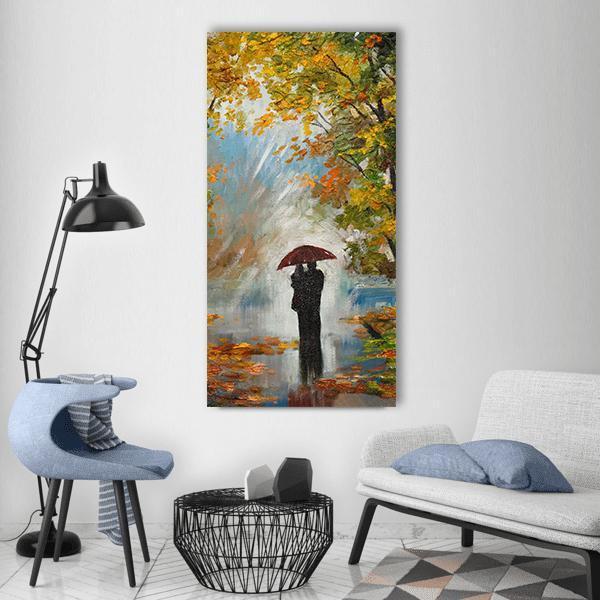 Couple Under Red Umbrella in Autumn Forest Vertical Canvas Wall Art in red, orange and yellow, single vertical panel hung on a wall