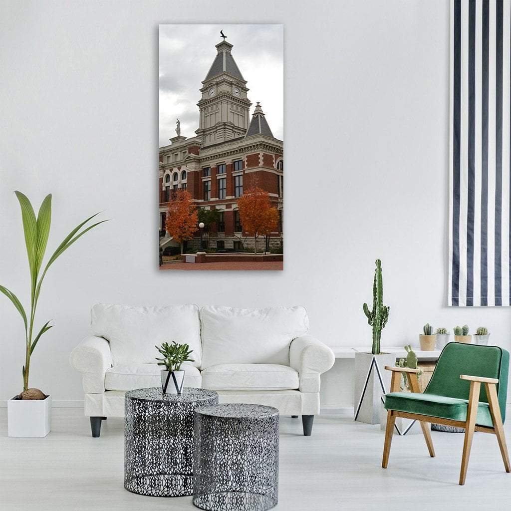 Historic Brick Courthouse with Clock Tower Vertical Canvas Wall Art in gray, brown and red, single vertical panel hung on a wall