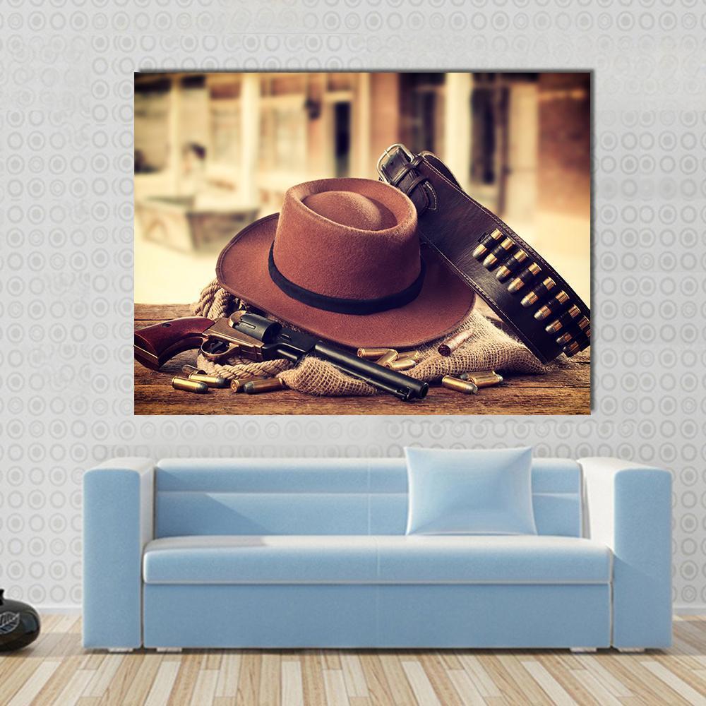 Cowboy Hat and Revolver Canvas Wall Art in black, beige and brown, single panel hung on a wall