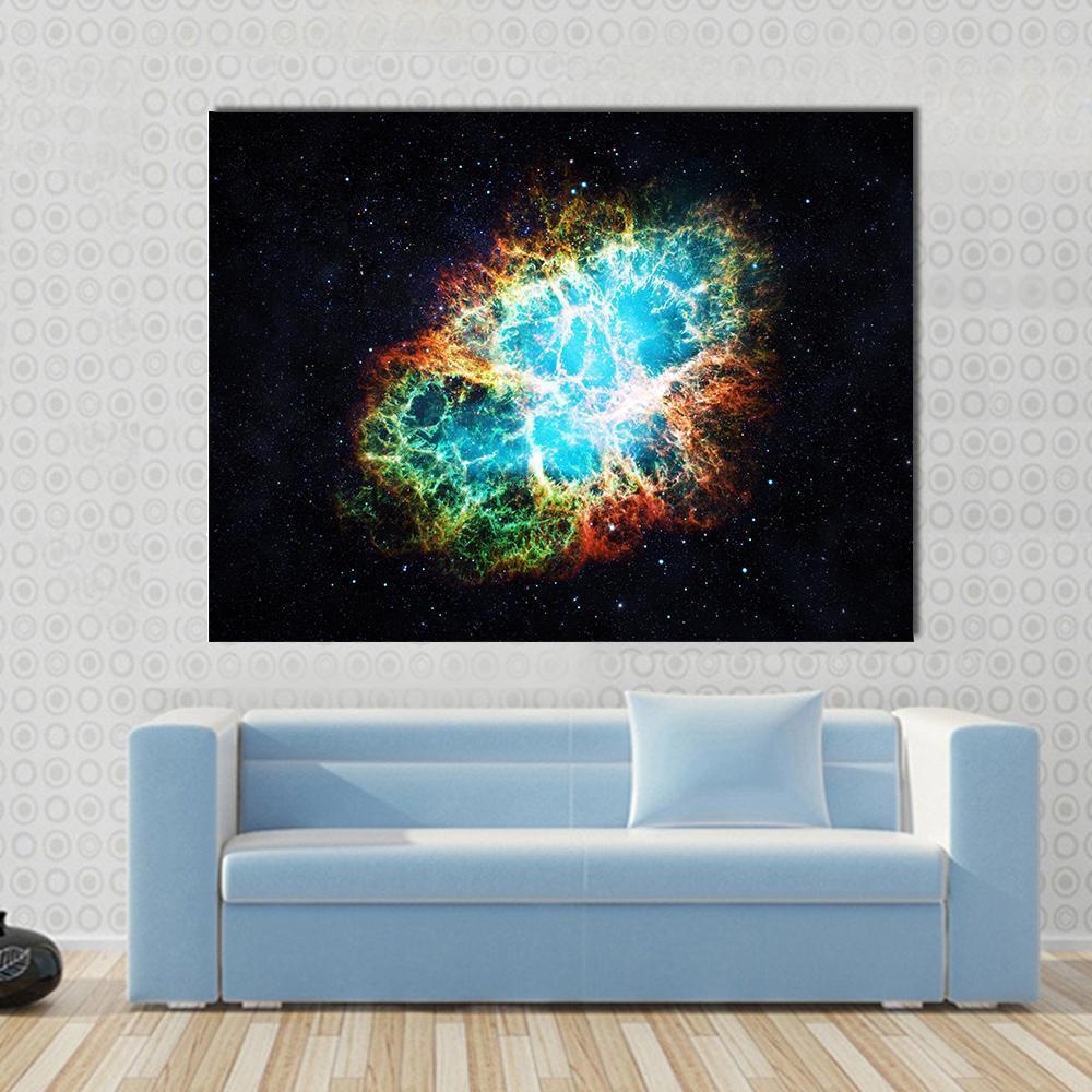 Crab Nebula Canvas Wall Art in black, orange and blue, single panel hung on a wall