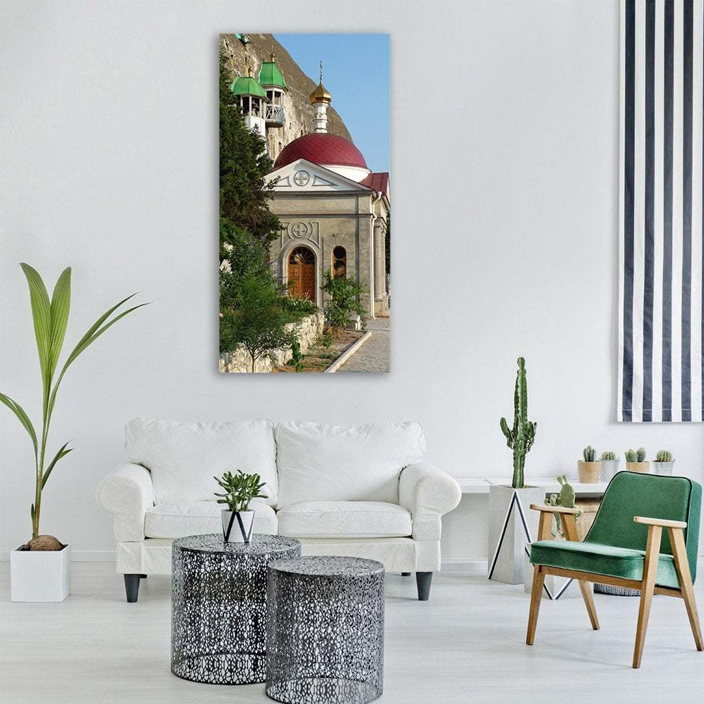 Crimea Cliffside Orthodox Church Vertical Canvas Wall Art in gray, green and blue, single vertical panel hung on a wall