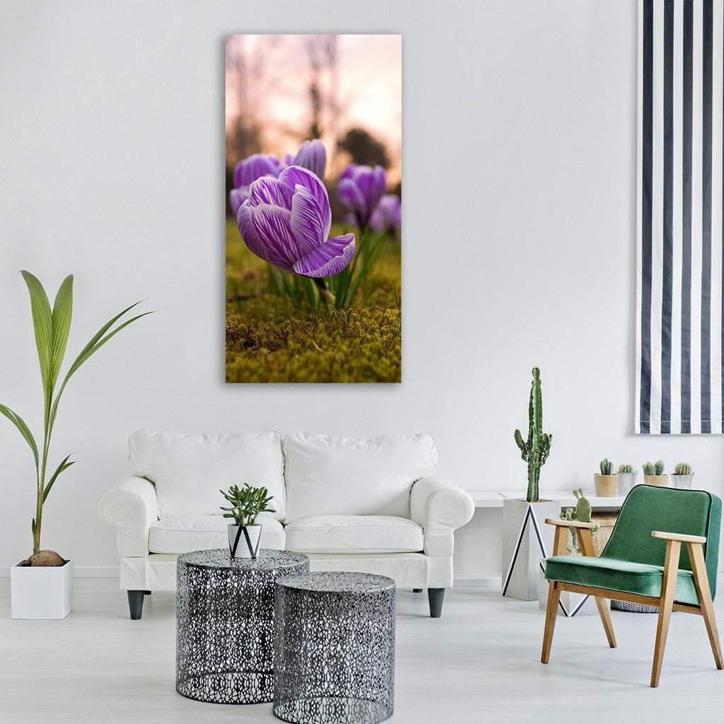 Crocus Rush Flower Vertical Canvas Wall Art in green and purple, single vertical panel hung on a wall