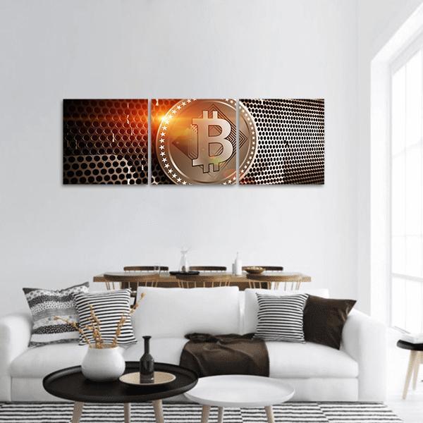 Bitcoin Coin on Perforated Metal Panoramic Canvas Wall Art in black, gold and orange, hung on a wall