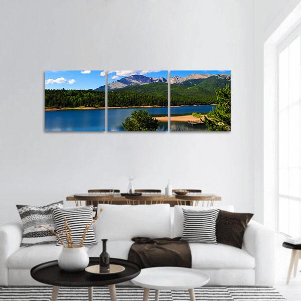 Reservoir Near Pikes Peak Panoramic Canvas Wall Art in green and blue, hung on a wall