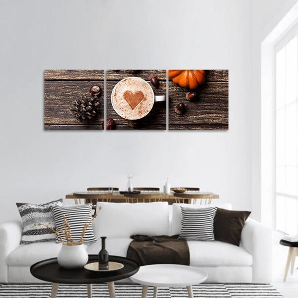 Coffee Cup with Pumpkin Panoramic Canvas Wall Art in white, brown and orange, hung on a wall