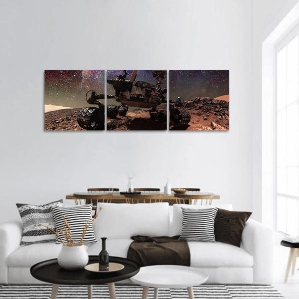 Curiosity Rover on Mars Panoramic Canvas Wall Art in black, brown and orange, hung on a wall