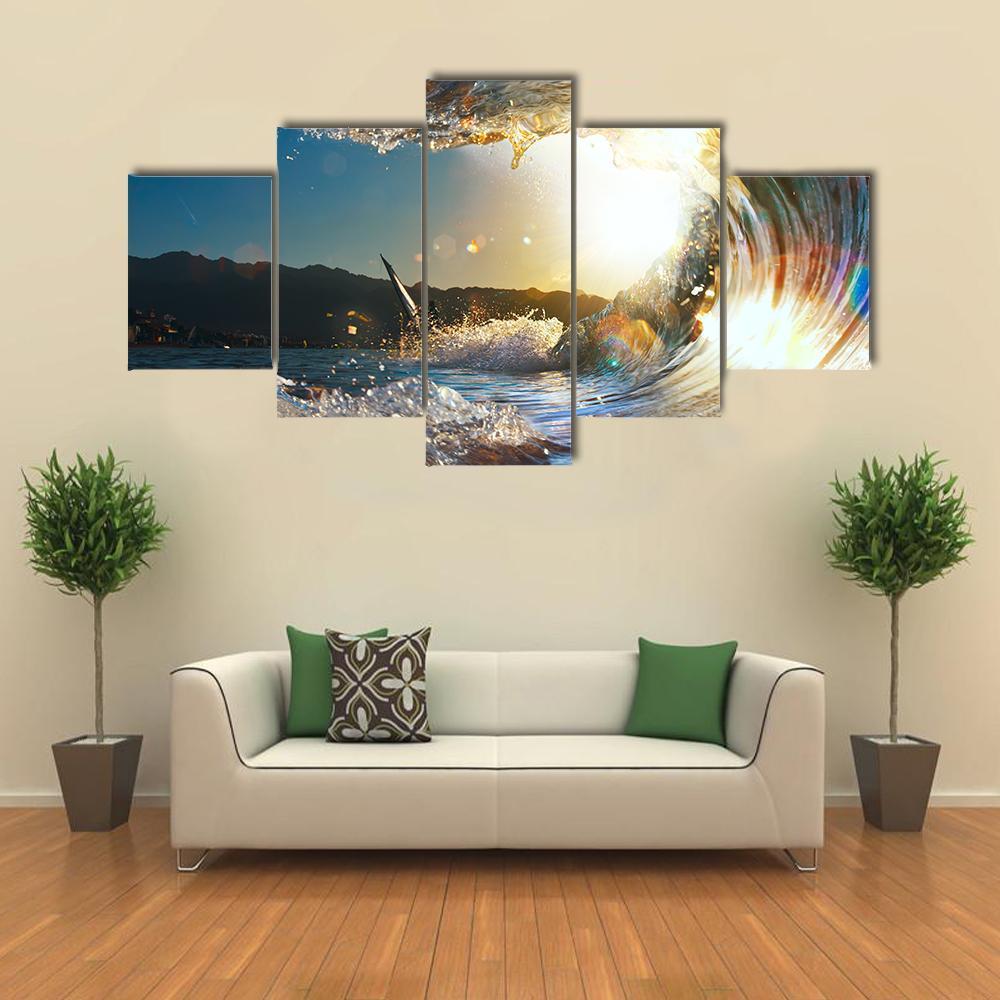 Curly Breaking Wave with Surfer Canvas Wall Art in white, yellow and blue, 5 panel Star layout hung on a wall