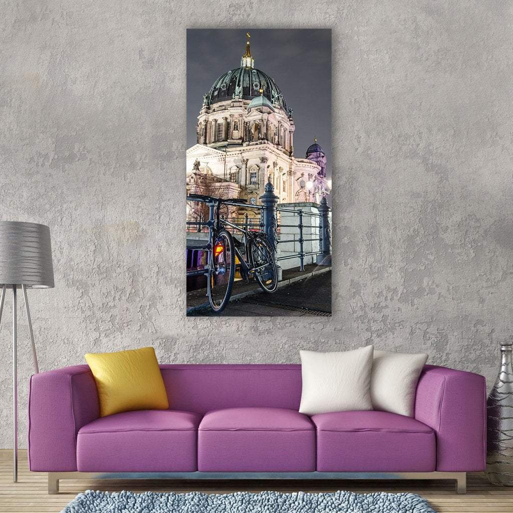 Bicycle by Berlin Cathedral at Night Vertical Canvas Wall Art in black, white and gray, single vertical panel hung on a wall