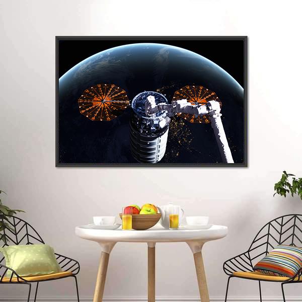 Cygnus Spacecraft Above Earth Canvas Wall Art in black, orange and blue, framed canvas, product view on a white background