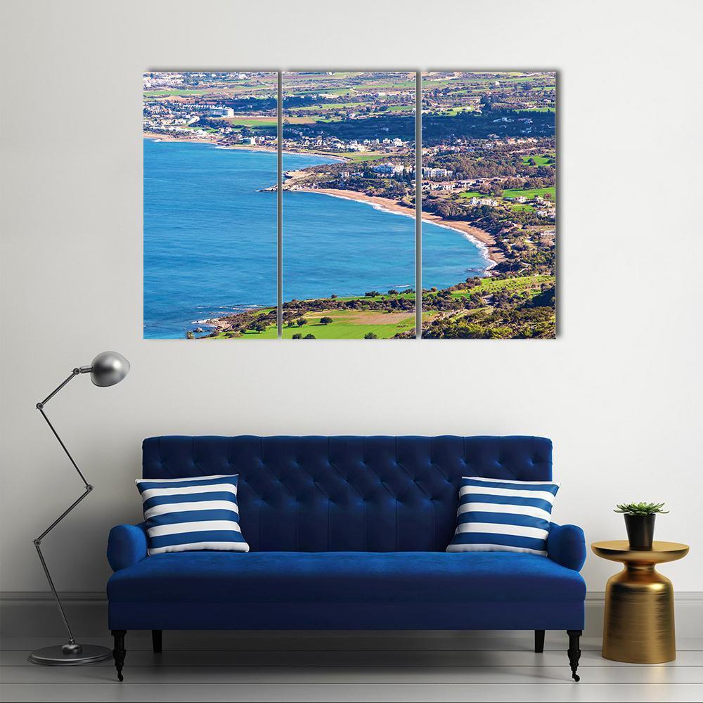 Latchi Coastline Aerial View Canvas Wall Art in beige, green and blue, 3 panel horizontal set hung on a wall
