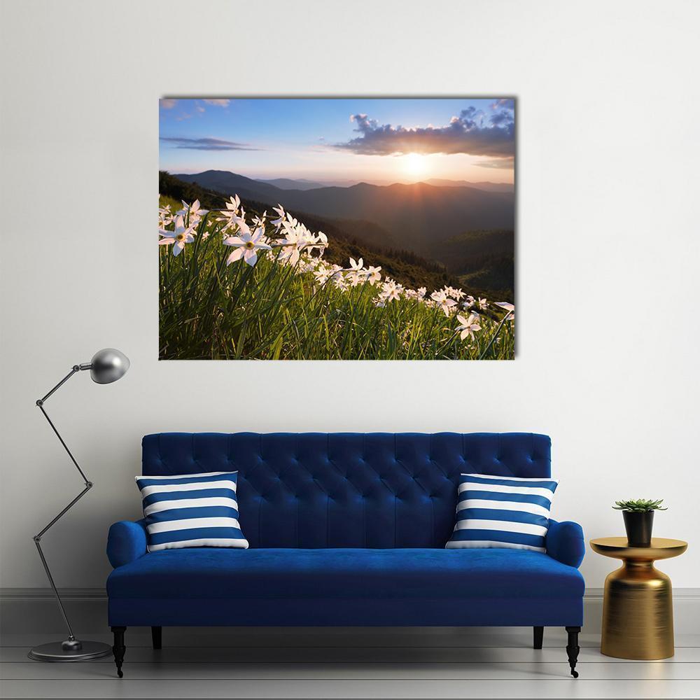 Daffodils on Mountain at Sunset Canvas Wall Art in orange, green and blue, single panel hung on a wall