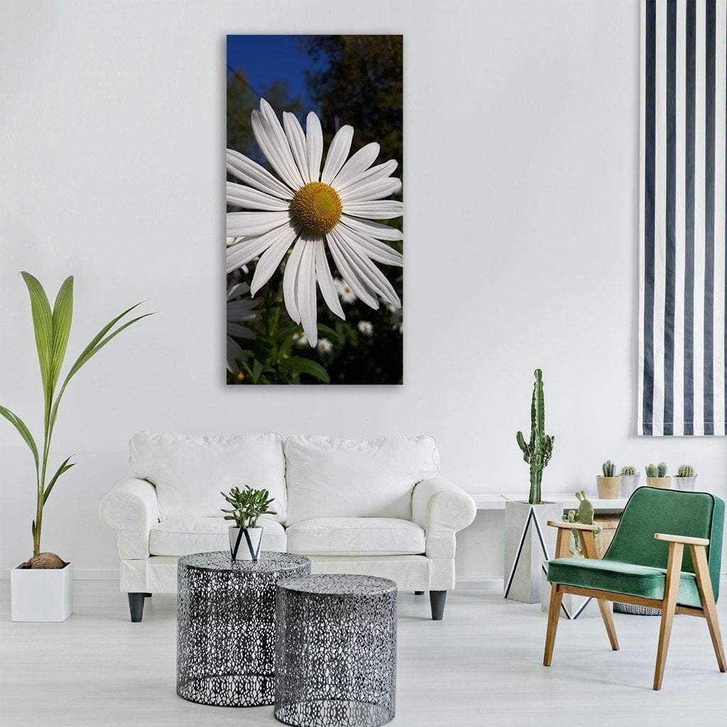 Daisy in Autumn Vertical Canvas Wall Art in white, yellow and blue, single vertical panel hung on a wall