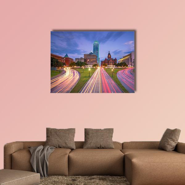 Downtown Dallas Light Trails Canvas Wall Art in yellow, blue and purple, single panel hung on a wall