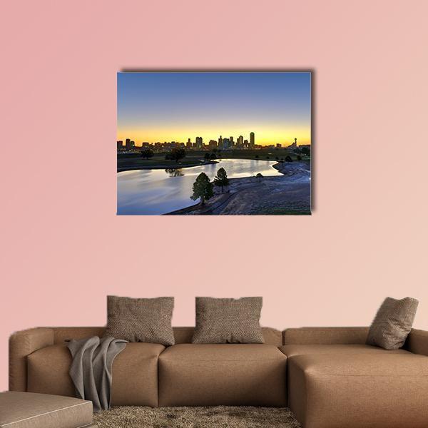 Dallas Skyline at Sunset Canvas Wall Art in orange, yellow and blue, single panel hung on a wall