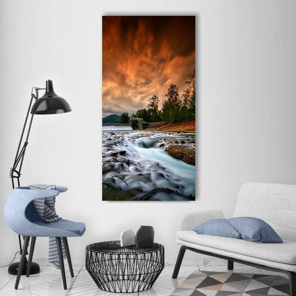 Dam Mentawa Sunset Over Rushing River Vertical Canvas Wall Art in brown, orange and blue, single vertical panel hung on a wall
