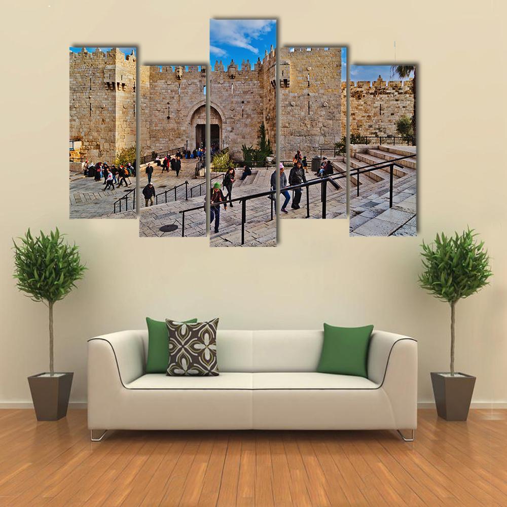Damascus Gate Courtyard Scene Canvas Wall Art in gray, beige and blue, 3 panel horizontal set hung on a wall