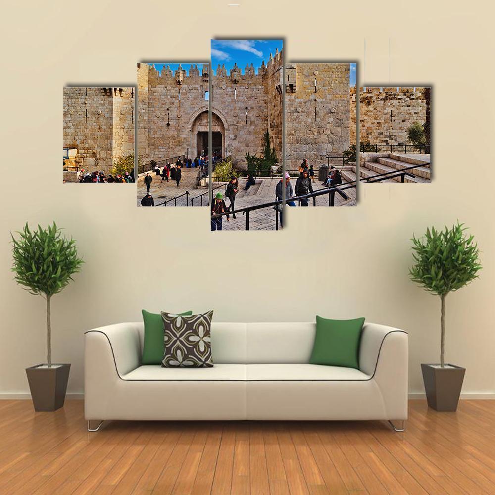 Damascus Gate Courtyard Scene Canvas Wall Art in gray, beige and blue, 3 panel horizontal set hung on a wall
