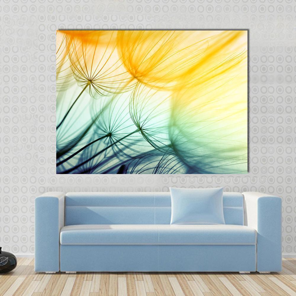 Dandelion Seed in Sunlight Canvas Wall Art in yellow, green and blue, single panel hung on a wall
