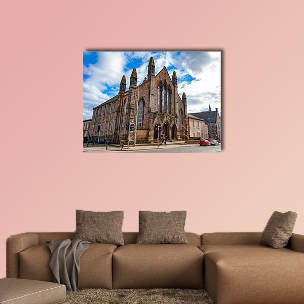 Dar Al-arqam Stone Building Canvas Wall Art in gray, brown and blue, single panel hung on a wall