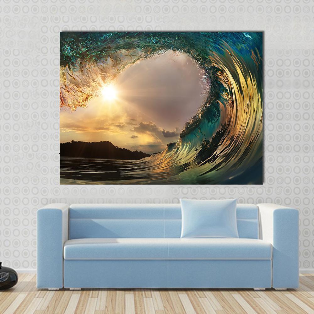 Barrel Wave at Sunset Canvas Wall Art in orange, yellow and blue, single panel hung on a wall