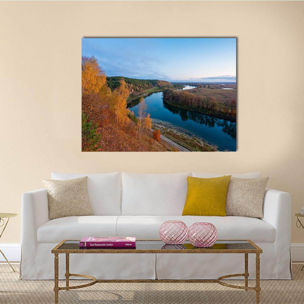 Autumn River in Late Afternoon Canvas Wall Art in orange, yellow and blue, single panel hung on a wall