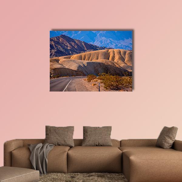 Death Valley Winding Road Canvas Wall Art in beige, brown and blue, single panel hung on a wall