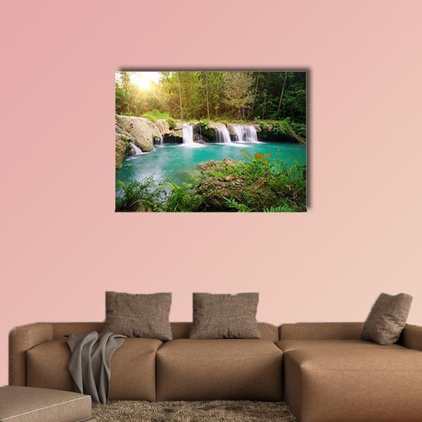 Tiered Waterfall in Deep Forest, Philippines Canvas Wall Art in brown, green and blue, single panel hung on a wall
