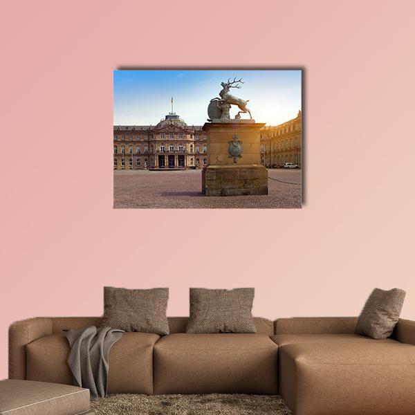 Deer Sculpture in Sunlit German Plaza Canvas Wall Art in beige, brown and blue, single panel hung on a wall