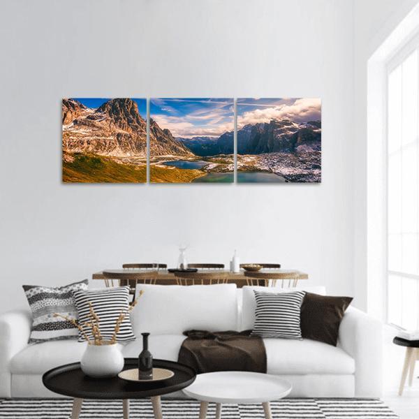 Del Piani Alpine Lakes Panoramic Canvas Wall Art in white, brown and blue, hung on a wall
