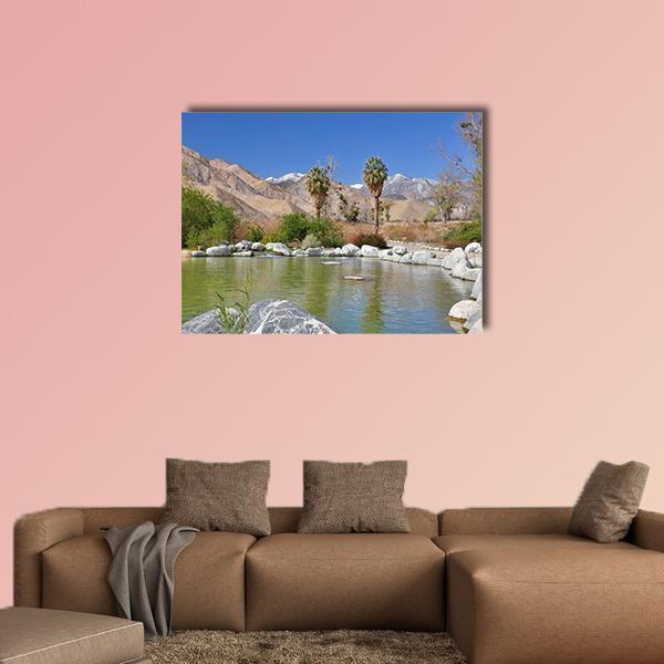 Pond in Desert Oasis Canvas Wall Art in brown, green and blue, single panel hung on a wall