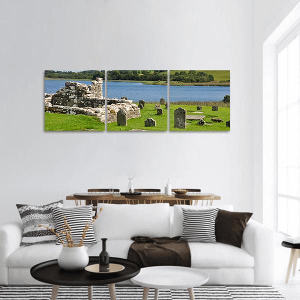 Devenish Island Ruins by Lake Panoramic Canvas Wall Art in gray, green and blue, hung on a wall