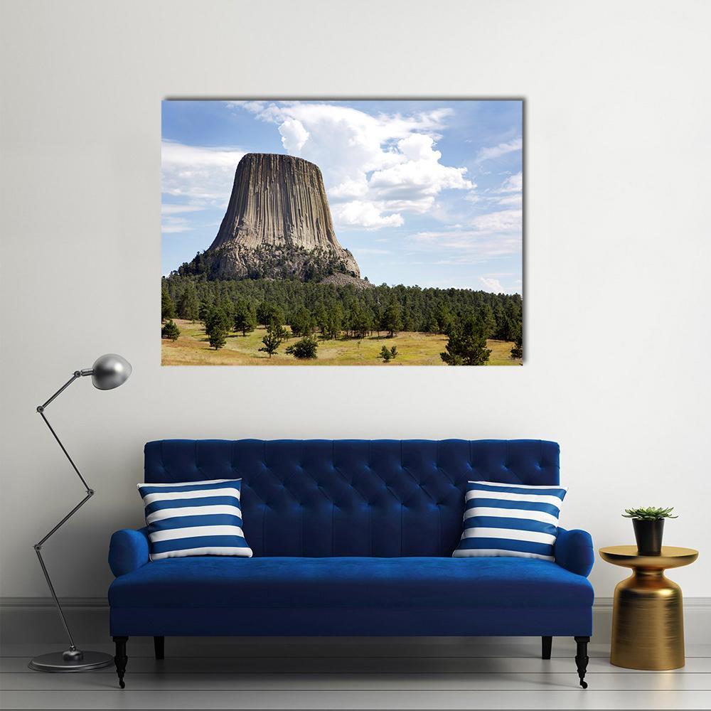 Devils Tower Wyoming Canvas Wall Art in brown, green and blue, single panel hung on a wall