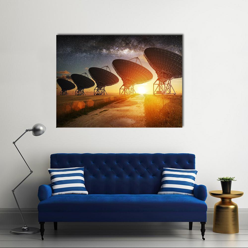 Radio Telescope Array Under the Milky Way Canvas Wall Art in black, orange and yellow, single panel hung on a wall