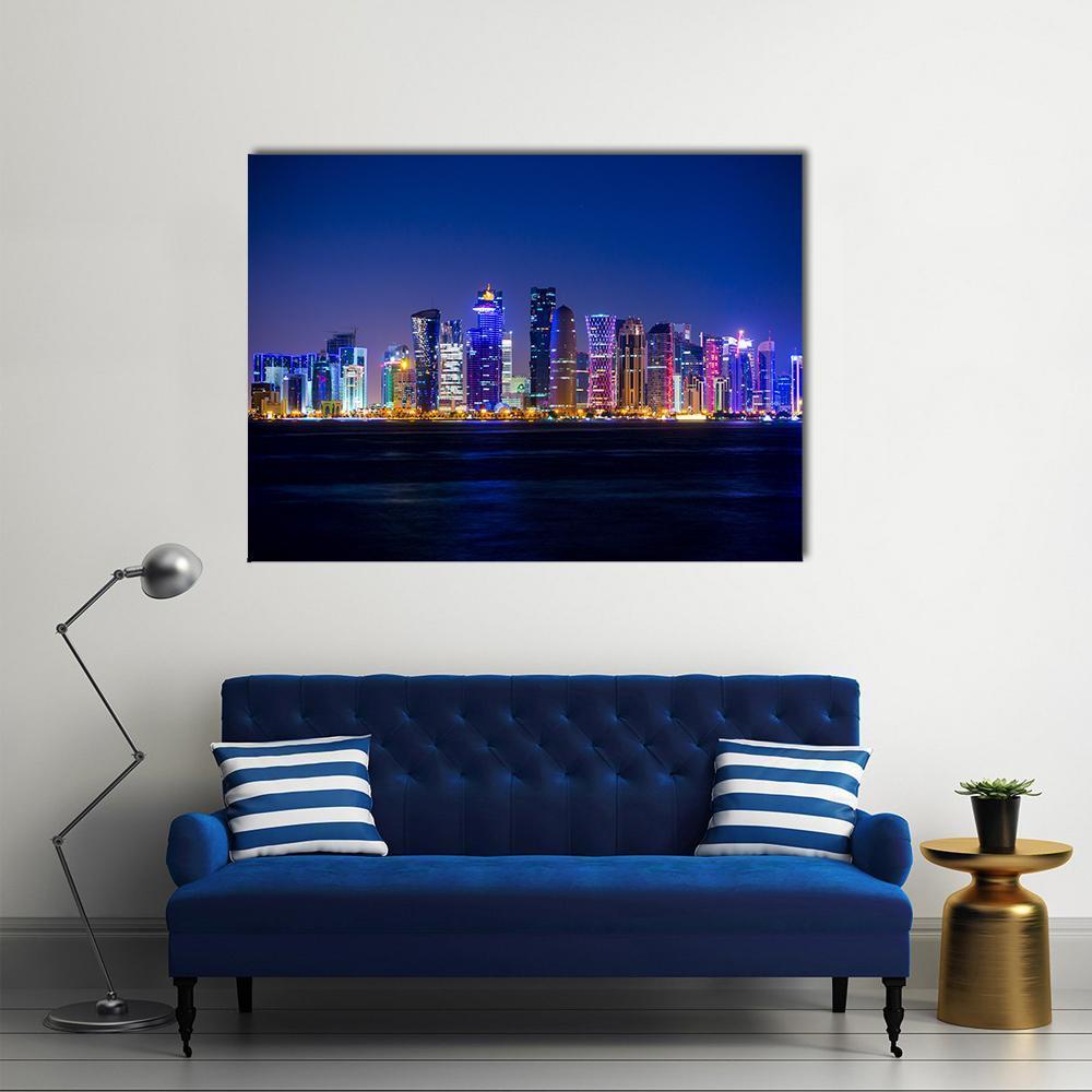 Doha Skyscrapers at Night Canvas Wall Art in black, blue and navy, single panel hung on a wall