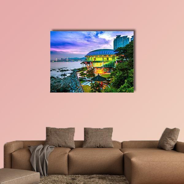 Circular Green Building and Pavilion at Sunset Canvas Wall Art in green, blue and purple, single panel hung on a wall