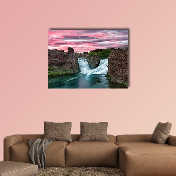 Twin Waterfalls with Magenta Sunset Canvas Wall Art in brown, blue and pink, single panel hung on a wall