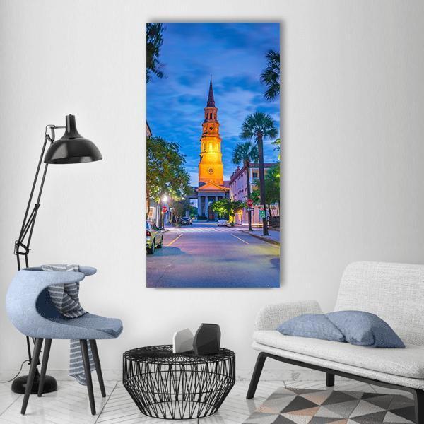 Charleston Downtown Twilight Street View Vertical Canvas Wall Art in yellow, green and blue, single vertical panel hung on a wall