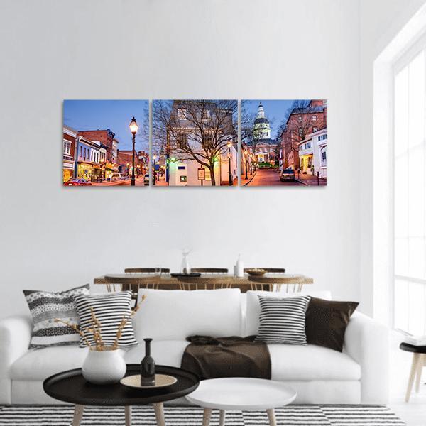 Downtown Main Street at Dusk Panoramic Canvas Wall Art in brown, orange and blue, hung on a wall