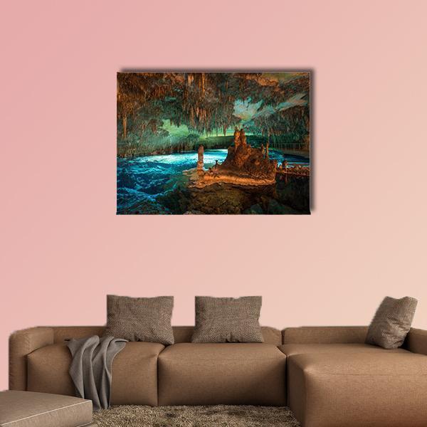 Dragon Caves Underground Lake Canvas Wall Art in brown, green and blue, single panel hung on a wall
