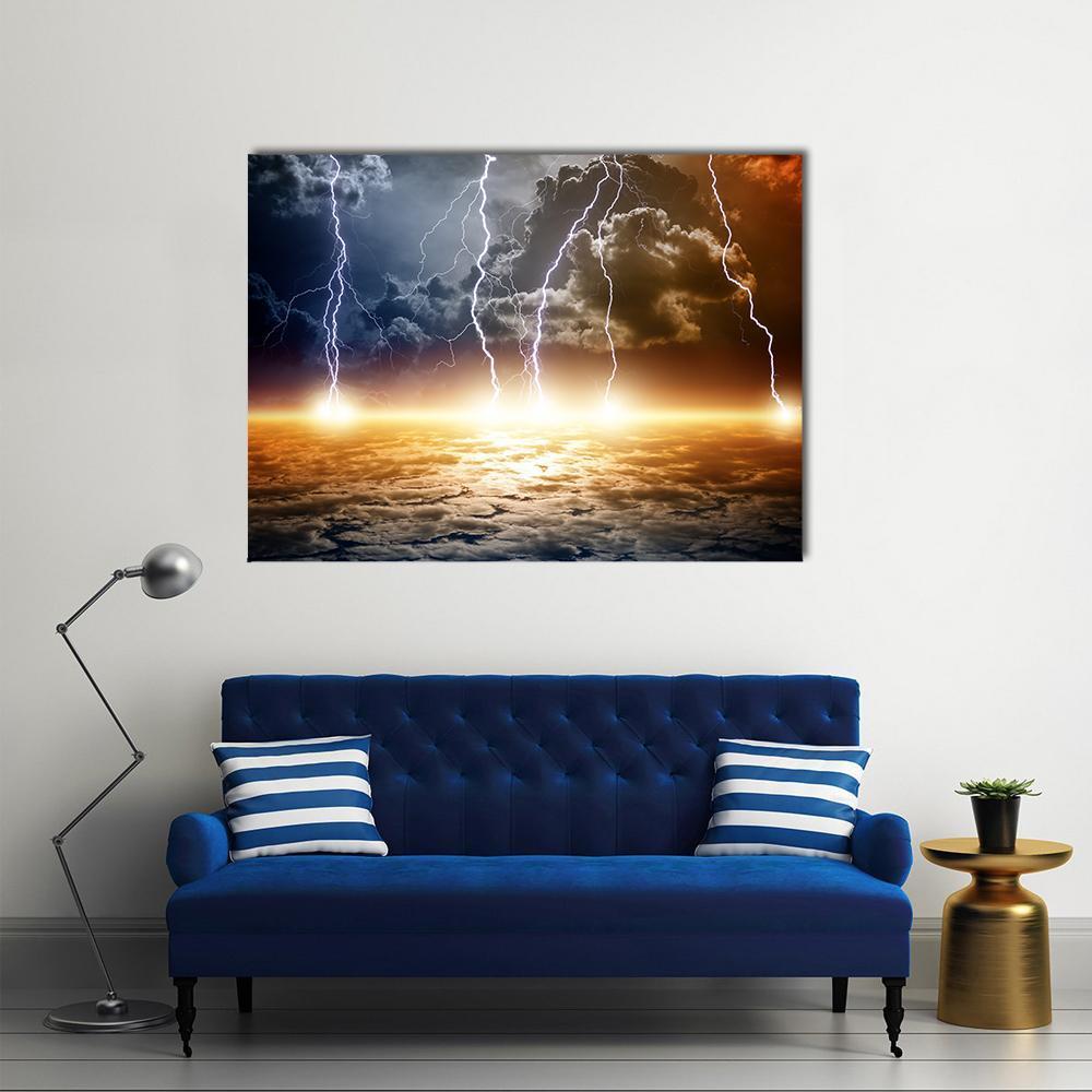 Bright Lightning Storm Over Glowing Horizon Canvas Wall Art in black, orange and blue, single panel hung on a wall