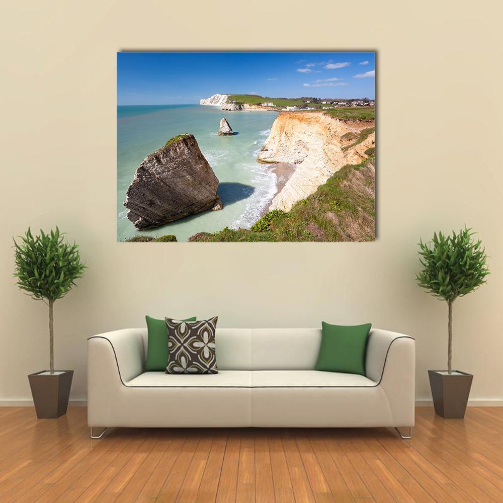 White Chalk Cliffs Over Ocean Canvas Wall Art in beige, green and blue, single panel hung on a wall