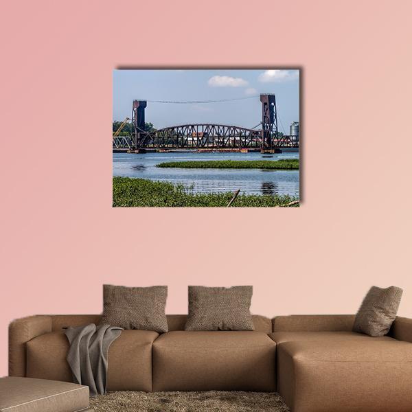 Drawbridge in Decatur Canvas Wall Art in brown, green and blue, single panel hung on a wall