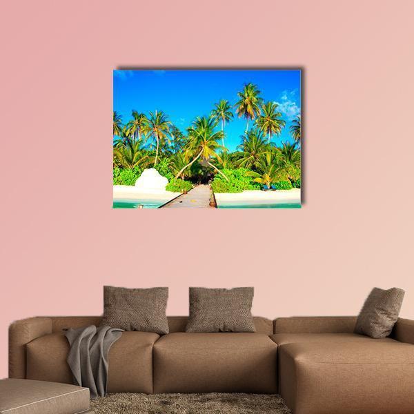 Maldives Pier and Palm Beach Canvas Wall Art in white, green and blue, single panel hung on a wall