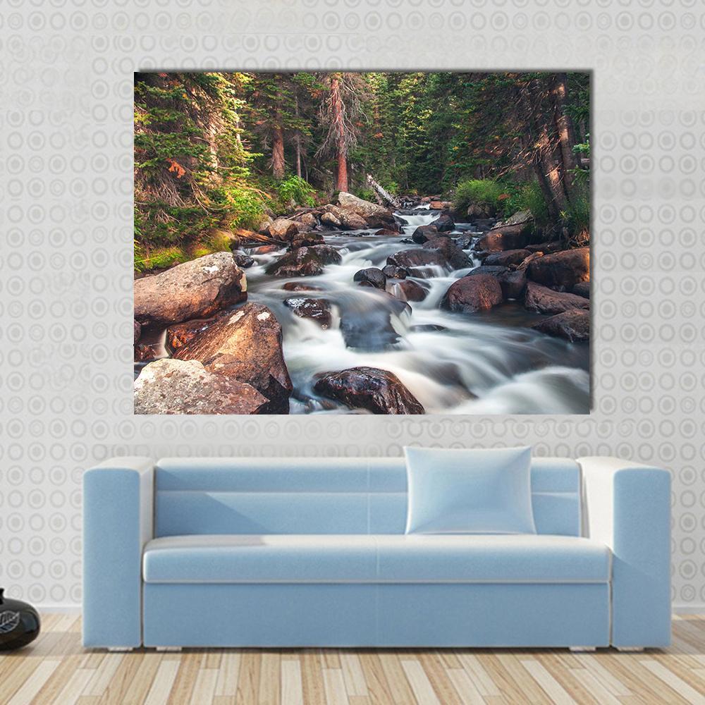 Dreamy Mountain Stream Canvas Wall Art in white, brown and green, single panel hung on a wall