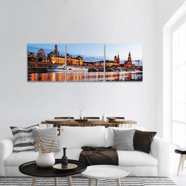 Elbe River at Night Panoramic Canvas Wall Art in black, orange and blue, hung on a wall