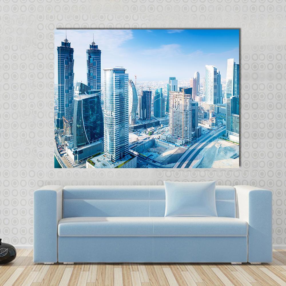 Dubai City Canvas Wall Art in white, gray and blue, single panel hung on a wall