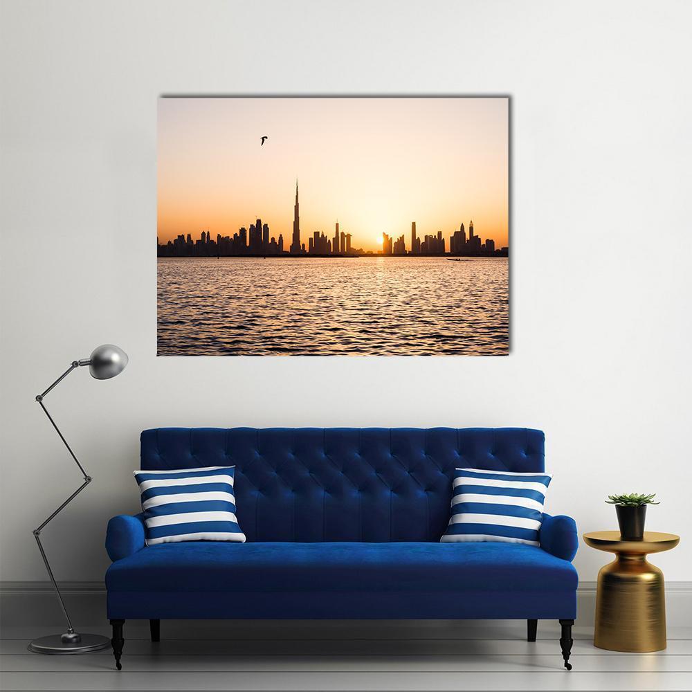 Dubai Cityscape at Sunset Canvas Wall Art in black, orange and yellow, single panel hung on a wall