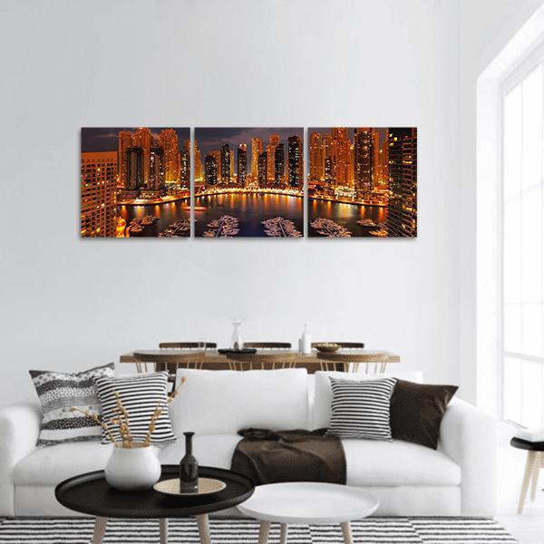 Dubai Marina at Dusk Panoramic Canvas Wall Art in gold, orange and blue, hung on a wall