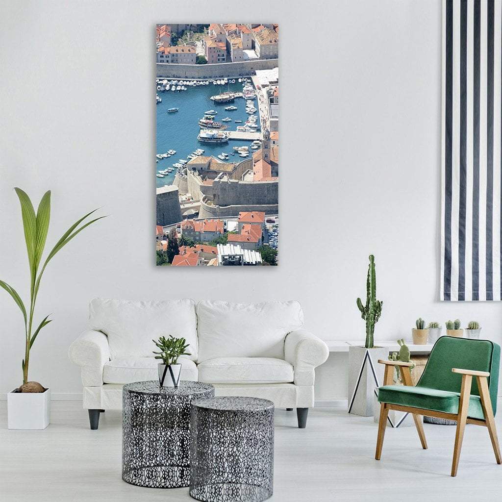 Aerial View of Dubrovnik Old Port Vertical Canvas Wall Art in beige, orange and blue, single vertical panel hung on a wall